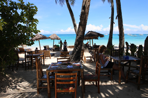Sit on Boracay beach with the sand between your toes and sip a cold drink