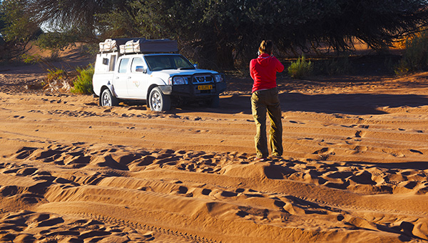 A vehicle stuck in deep sand near Sesriem showing why 4x4 with sand experience matters