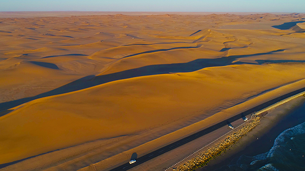 Sun-blasted desert landscape near Walvis Bay illustrating the intensity of Namibian sunlight