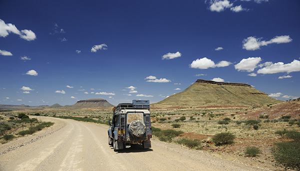 A gravel road stretching to the horizon in Namibia