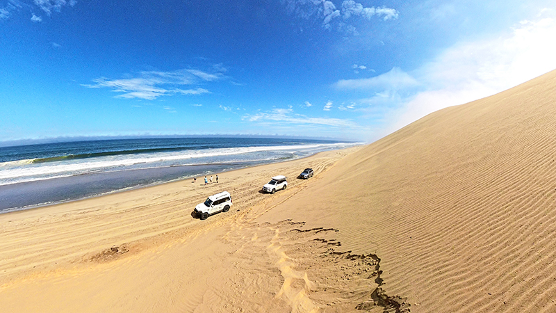 Namib dunes falling directly into the Atlantic Ocean at Sandwich Harbour