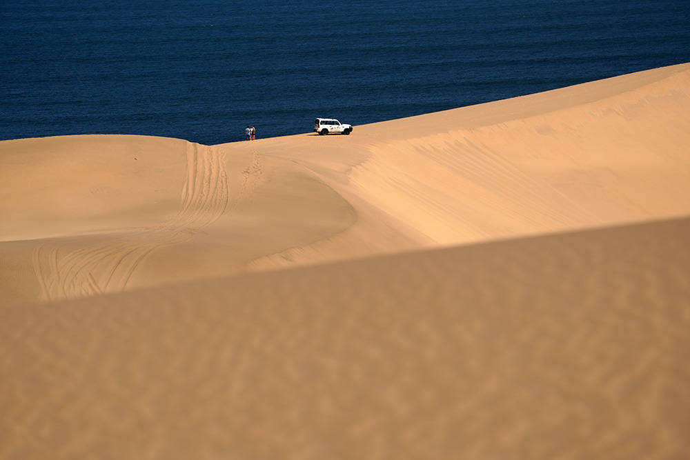 Giant dunes plunging into the Atlantic Ocean at Sandwich Harbour near Walvis Bay